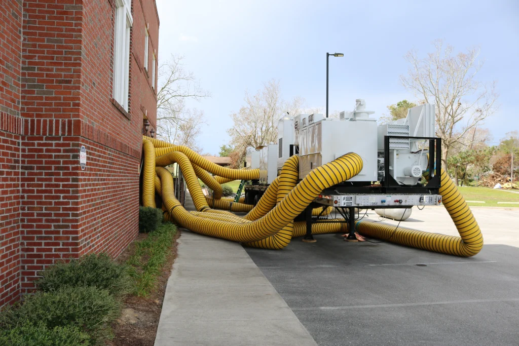 Large loss restoration equipment staged at hospital — commercial water damage restoration