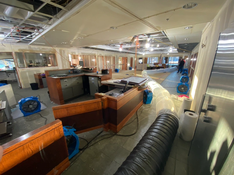 Commercial bank office water damage restoration after water line failure