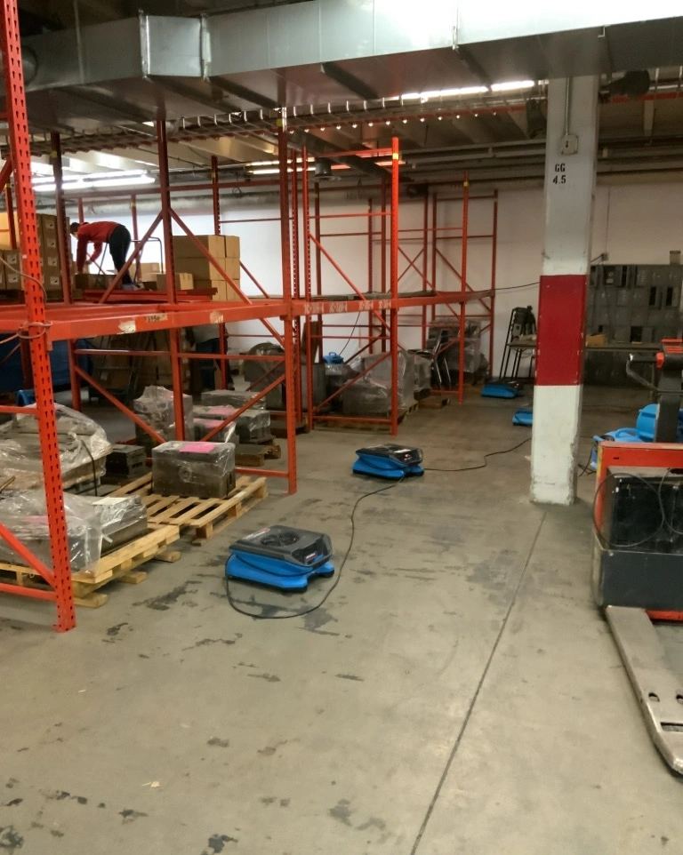 Industrial warehouse water damage restoration after broken water line